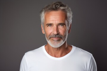 Obraz premium Portrait of a jovial man in his 50s sporting a long-sleeved thermal undershirt over plain white digital canvas