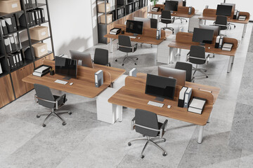 Top view of office workspace interior with pc computers on desks with chairs