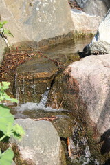 A small waterfall in the middle of stones