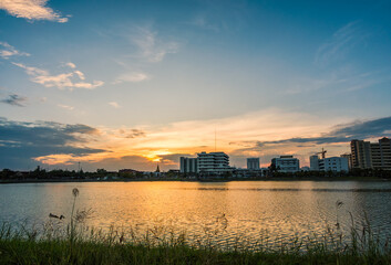 Fototapeta premium Sunset with lake in Public Park landscape