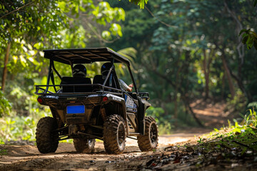 Fototapeta premium Buggy car driving into a rainforest road