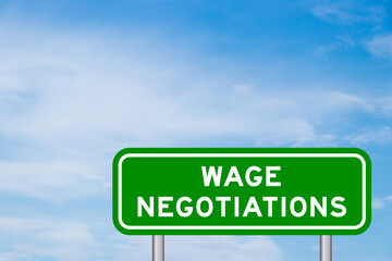 Green color transportation sign with word wage negotiations on blue sky with white cloud background