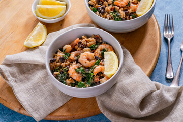 Prawn and chorizo risotto with black beans and calvo nero