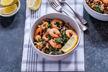Prawn and chorizo risotto with black beans and calvo nero