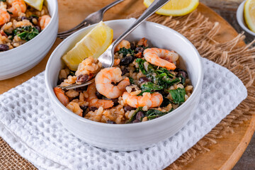 Prawn and chorizo risotto with black beans and calvo nero
