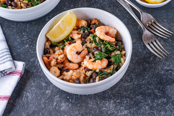Prawn and chorizo risotto with black beans and calvo nero