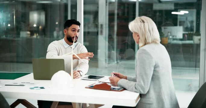People, business and meeting in office with wind turbine for green energy, power and electricity supply. Employee, client and proposal or pitch with feedback as engineer in boardroom for project