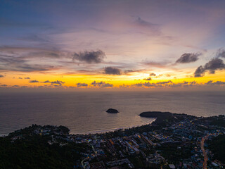 aerial view colorful cloud in sunset looked strangely beautiful. Horizon dramatic twilight sky and cloud sunset background. amazing sky at sunset scenery sunset above the island at Kata beach Phuket.