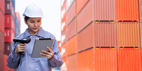 Portrait of an engineer inspecting products using a barcode scanner.