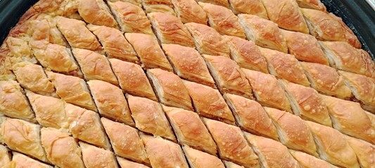 Turkish dessert baklava with sherbet on a tray
