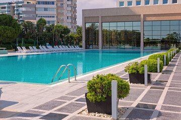 Swimming pool at a resort with landscaping; copy space