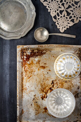 Various old kitchen objects on black chalkboard background