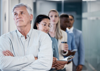 Fototapeta premium Mature man, tired and line in waiting room for interview, recruitment and opportunity for job. Person, group and queue for offer, onboarding and hiring with fatigue, bored or career in modern office