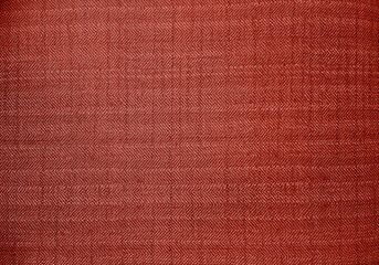 close up red color fabric texture. fabric herringbone,zigzag, chevron pattern. upholstery or drapery abstract textile fabric background for design.