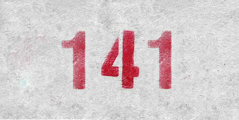 Red Number 141 on the white wall. Spray paint.