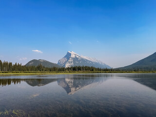 Mount Rundle and Sulphur Mountain are reflected in the lakes. Vermilion Lakes, Alberta, Canada.