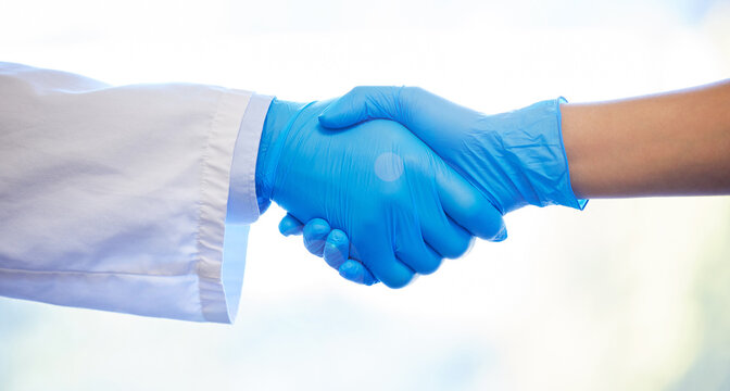 Doctor, gloves and handshake for deal in healthcare, welcome greeting and introduction for partnership. People, shaking hands and agreement for collaboration or medical support, unity and teamwork.