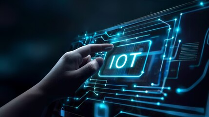 A hand touching the word IOT on futuristic screen