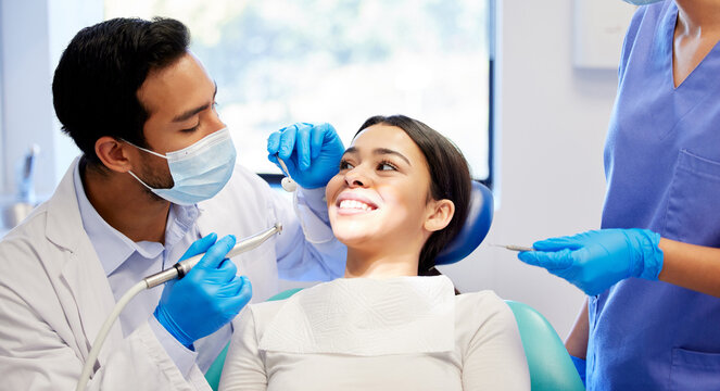 Oral care, dentist and procedure with patient for health, wellness and teeth whitening in practice. Happy woman, ppe and dental specialist with tools for consultation, cleaning and filling on chair