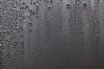 Close up of water droplets on dark cover background. Water droplets concept