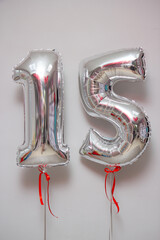silver foil balloons numbers 1 and 5