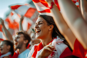A close-up shot of Austrian football fans with red and white flags, passionately cheering and supporting their team in the stadium 