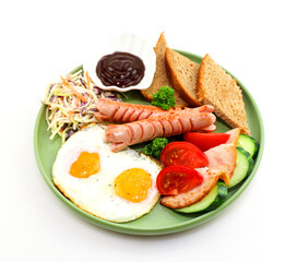 Hearty breakfast with scrambled eggs and sausages