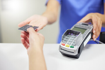 Medical, people and credit card in hospital with nurse, healthcare and insurance payment with fintech. Clinic, help and patient service with pos machine, budget and finance for doctor consultation