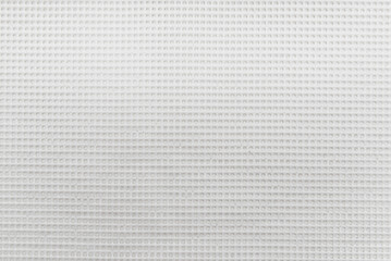 Texture of a white mesh silicone mat. Silicone material background. Net