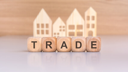 visual representation of a real estate proposal using wooden blocks and house symbols