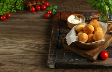 traditional Italian arancini with cheese and basil