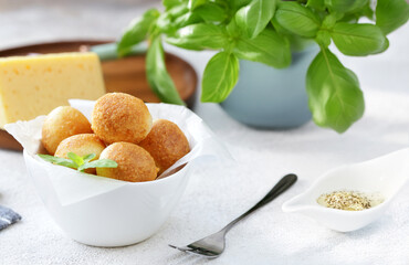 traditional Italian arancini with cheese and basil