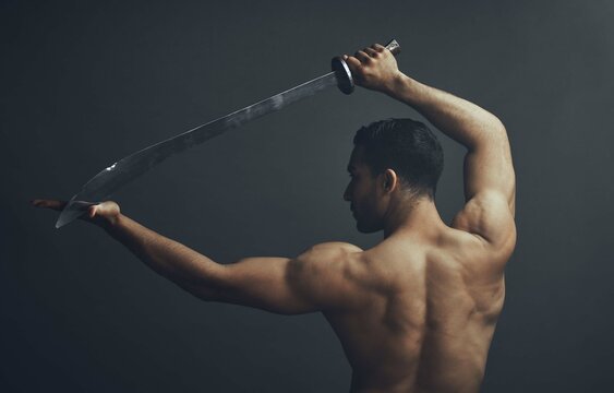 Back view, ninja and samurai sword in studio for training, wellness and fitness with martial arts. Blade, exercise and warrior by black background for karate, fight and battle for dojo in Japan