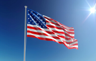 Fototapeta premium American flag waving in the wind on blue sky background, 