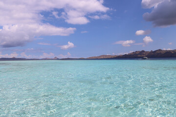 tropical island in the sea an turquoise water
