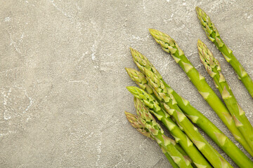 Fresh green asparagus on grey background. Healthy food concept. Vegan healthy food.