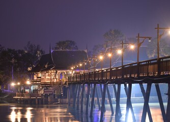 Thai pavillion and bridge  cross the canal  at night.decorate  with  the light