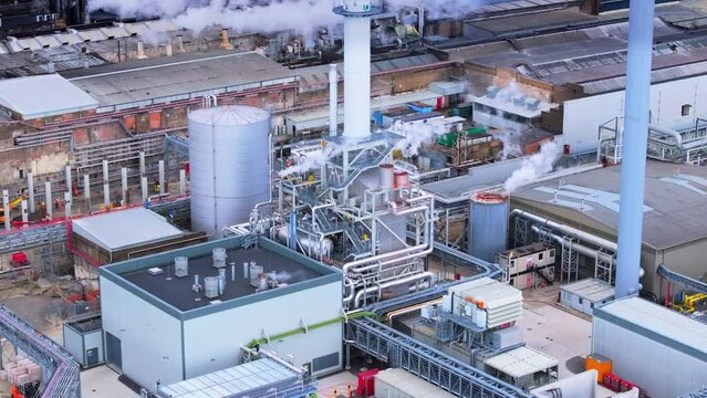 Wide angle aerial shot of Paper Mill and industrial works with chimneys and machinery, UK