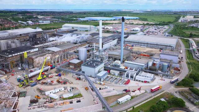 Wide angle aerial shot of Paper Mill and industrial works with chimneys and machinery, UK