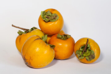 
Persimmons on white background