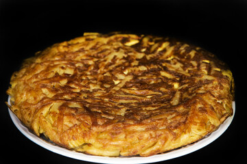 
Steaming macaroni omelette on a black background