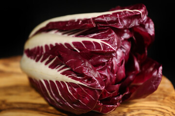red radicchio on a black background