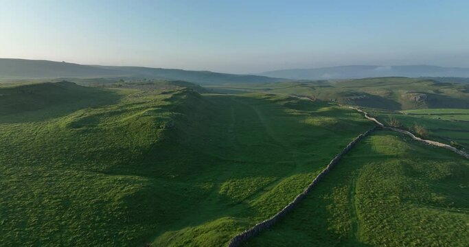 Flying over green hills in Yorkshire Dale