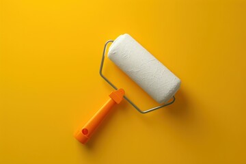 Obraz premium Painting tools on yellow surface with roller and brush artistic essentials for home decor and diy projects