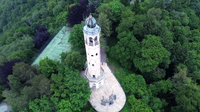 spectacular aerial view of Alessandro Volta lighthouse with romantic and colored sunset background landscape on Como Lake mountains 4