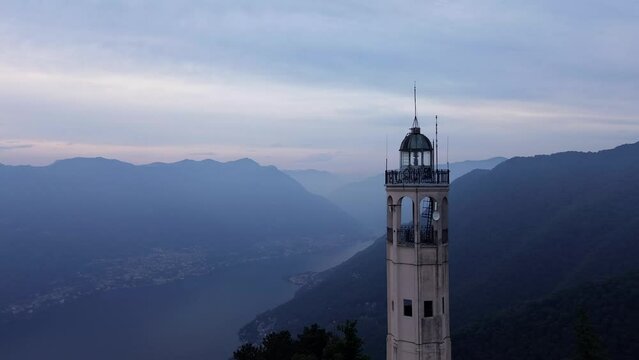 spectacular aerial view of Alessandro Volta lighthouse with romantic and colored sunset background landscape on Como Lake mountains 5