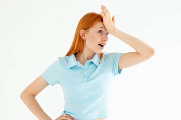 Fototapeta premium Gosh why me. Portrait of unhappy displeased and annoyed young arrogant woman in blue top facepalming with irritation breathing out with opened mouth and rolling eyes from annoyance and exhaust