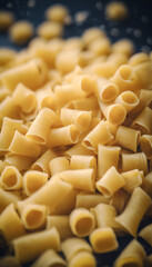 Close-up of uncooked pasta scattered in a pile. World Pasta Day.