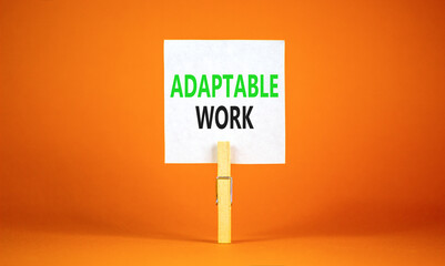 Adaptable work symbol. Concept words Adaptable work on beautiful white paper on wooden clothespin. Beautiful orange background. Business Adaptable work concept. Copy space.