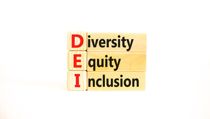 DEI diversity equity and inclusion symbol. Concept words DEI diversity equity inclusion on blocks on beautiful white background. Business DEI diversity equity and inclusion concept. Copy space.
